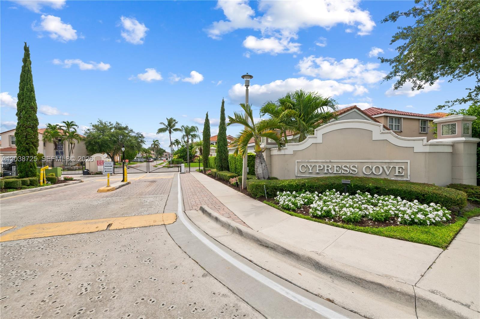 The entrance to the Cypress Cove residential community features a gated road and signage — 2021 Barcelona Ter, Margate FL 33063, MARGATE, FL