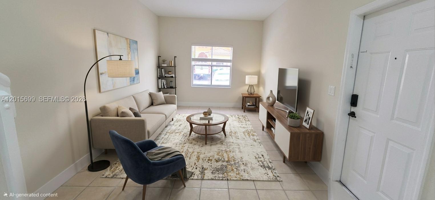 This is a living room featuring a sofa, blue armchair, area rug, and television console — 4950 Tradewinds Ter # 505, Dania Beach FL 33312, DANIA BEACH, FL