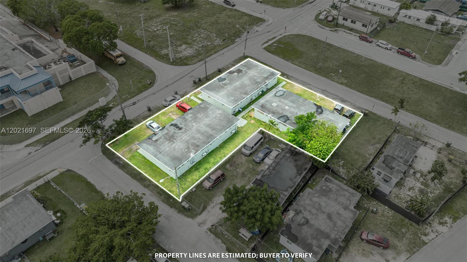 An aerial view shows two rectangular buildings on a corner lot with surrounding parking — 651 SW 4th Ave, Homestead FL 33030, HOMESTEAD, FL