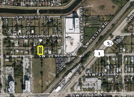 An aerial map shows a highlighted rectangular property lot located near a major highway intersection — XXX S 214 st, Miami FL 33177, MIAMI, FL