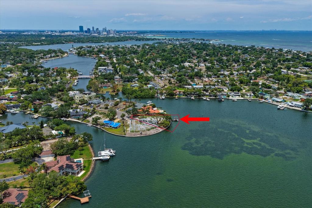 An aerial view shows a waterfront property with a red-outlined lot and a boat dock — 4838 PARADISE WAY S, ST PETERSBURG, FL
