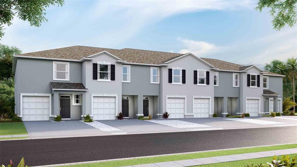 This is a rendering of a row of multi-story townhomes with attached garages and driveways — 32451 WELLING BLADE LOOP, WESLEY CHAPEL, FL