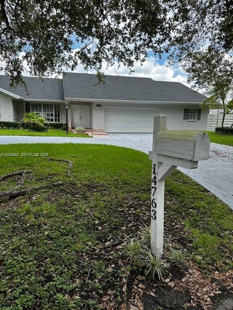 A single-story house with a gray roof and a white mailbox in the foreground — 14763 SW 152nd Pl, Miami FL 33196, MIAMI, FL
