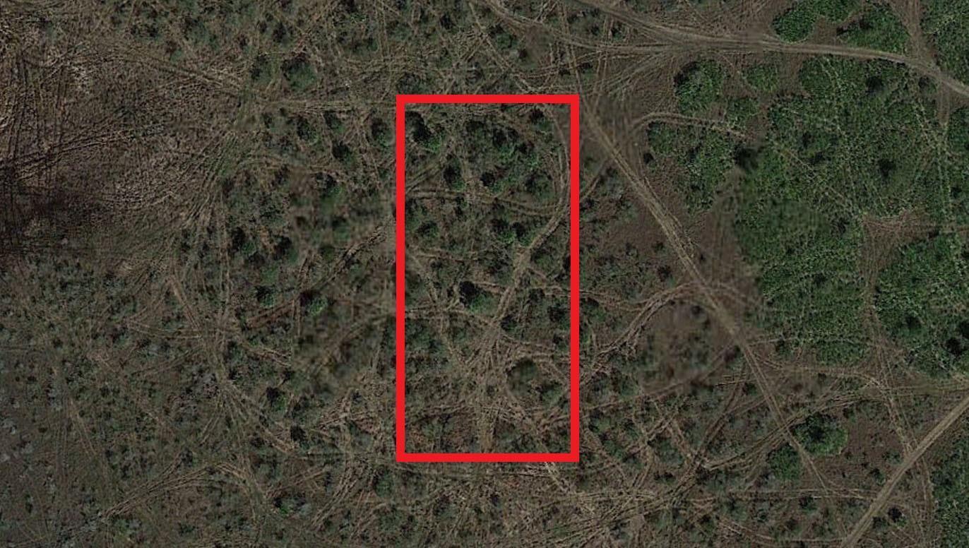 An aerial view shows a rectangular plot of land marked by a red border — 0 NW 310th Street, Okeechobee FL 34972, OKEECHOBEE, FL