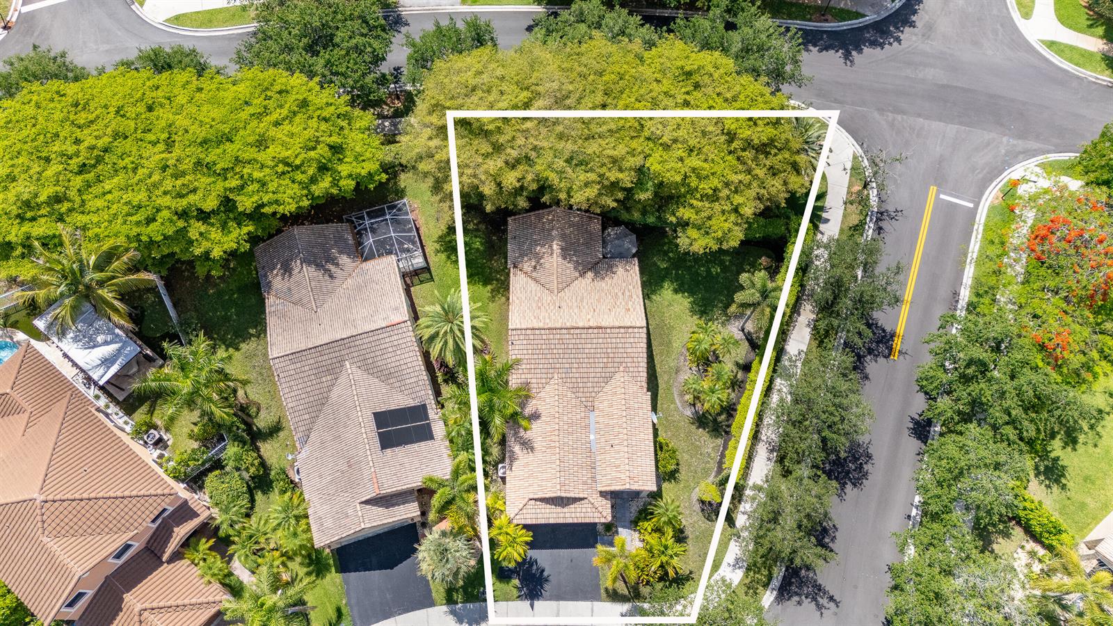 An aerial view shows a single-family home with a tiled roof and a landscaped yard — 1252 Sabal Trail, Weston FL 33327, WESTON, FL