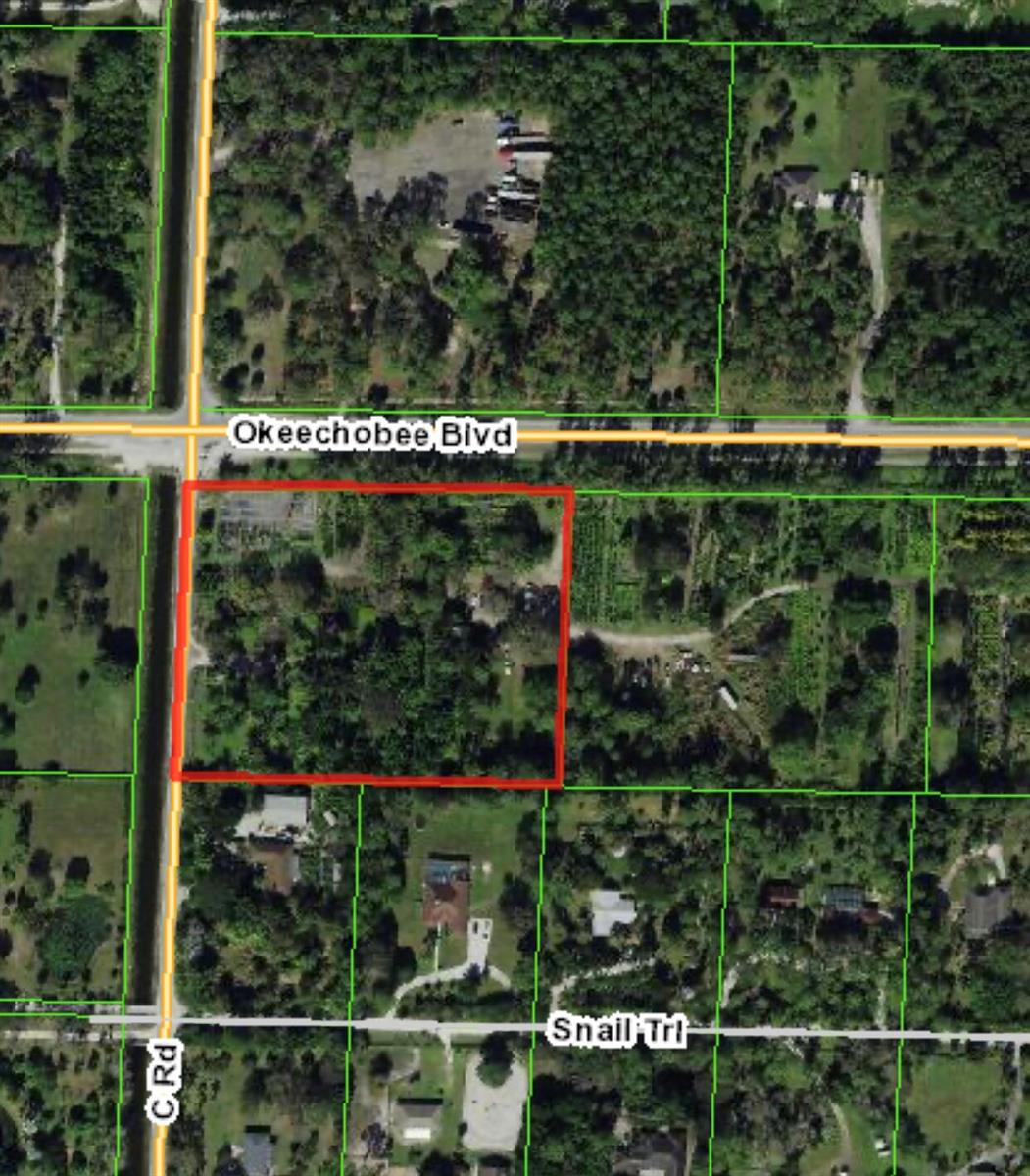 This is an aerial map showing a rectangular property outlined in red near a road intersection — 14920 Okeechobee Boulevard, FL 33470, FL