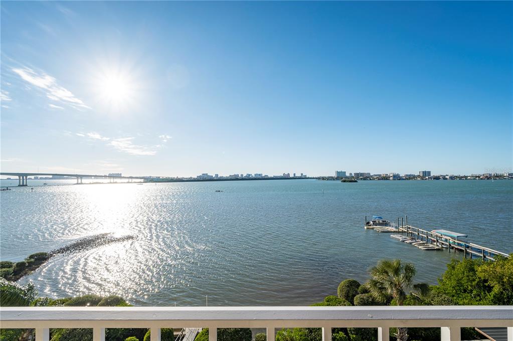 A view from a balcony overlooking a large body of water with a bridge — 500 N OSCEOLA AVENUE UNIT 307, CLEARWATER, FL