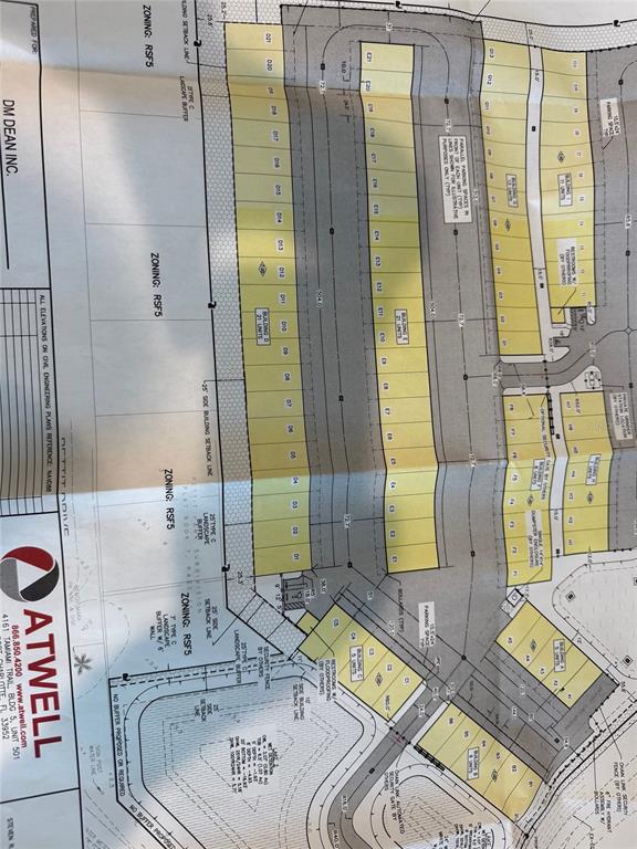 This is a site plan rendering showing the layout of multiple buildings and parking areas — 25155 AIRPORT ROAD UNIT D-1, PUNTA GORDA, FL