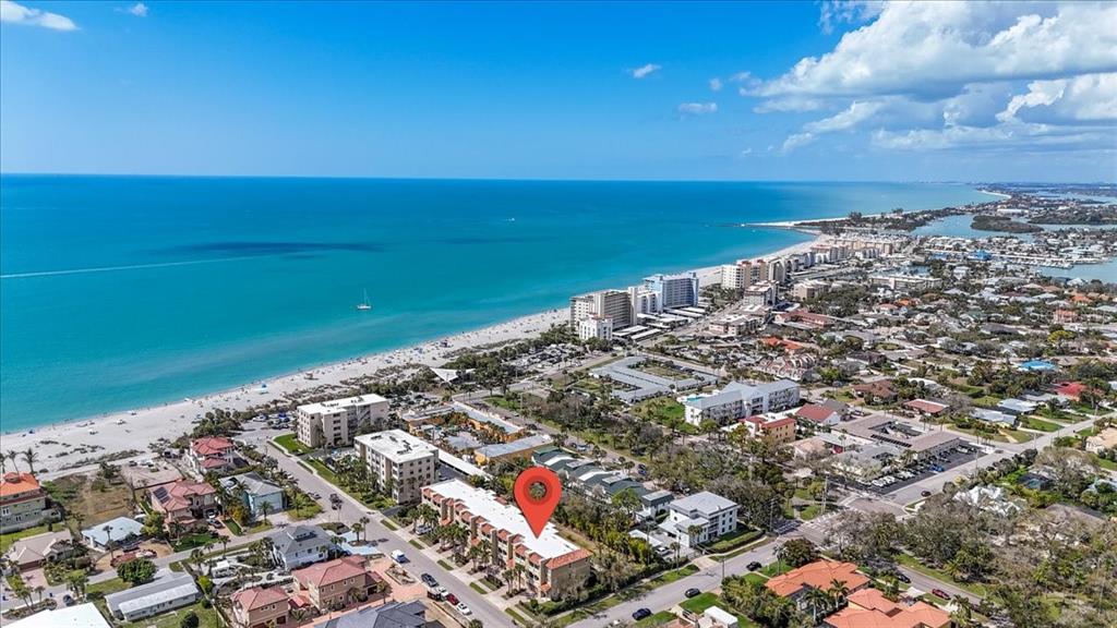 An aerial view shows a multi-story residential building marked with a pin near the beach — 702 GRANADA AVENUE UNIT 7, VENICE, FL