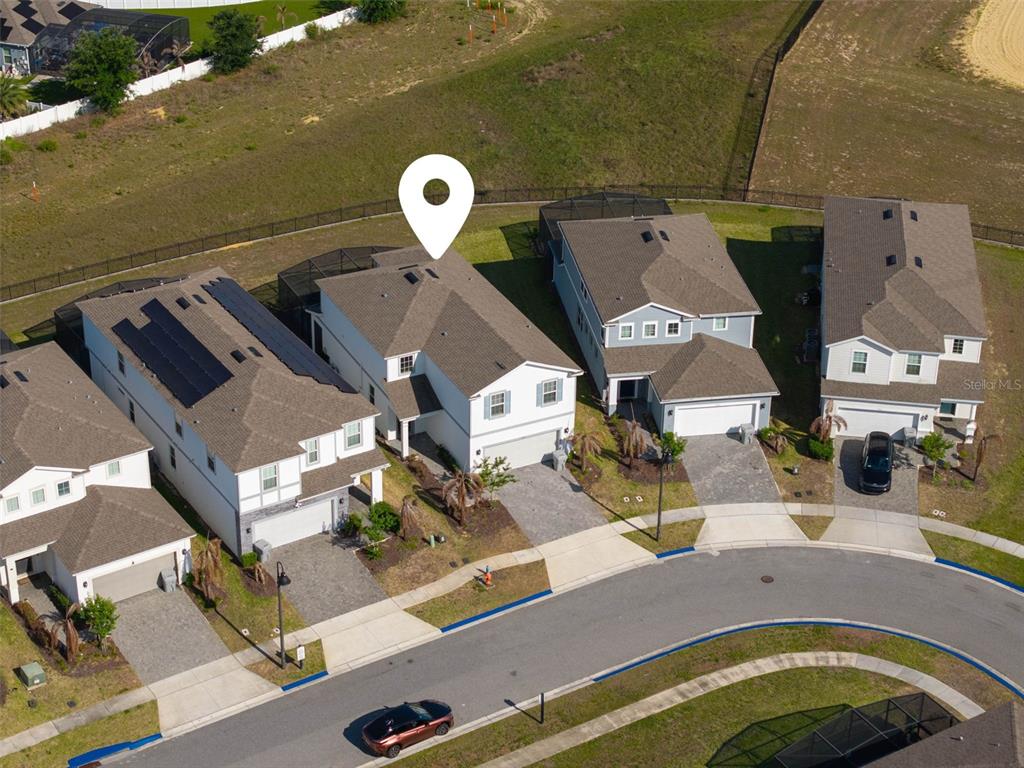 An aerial view shows a row of suburban houses with a location pin on one — 1721 KONA LANE LANE, DAVENPORT, FL