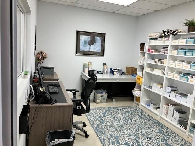 A home office features a desk, an ergonomic chair, and white shelving units — 290 SW 12th Avenue, Pompano Beach FL 33069, POMPANO BEACH, FL