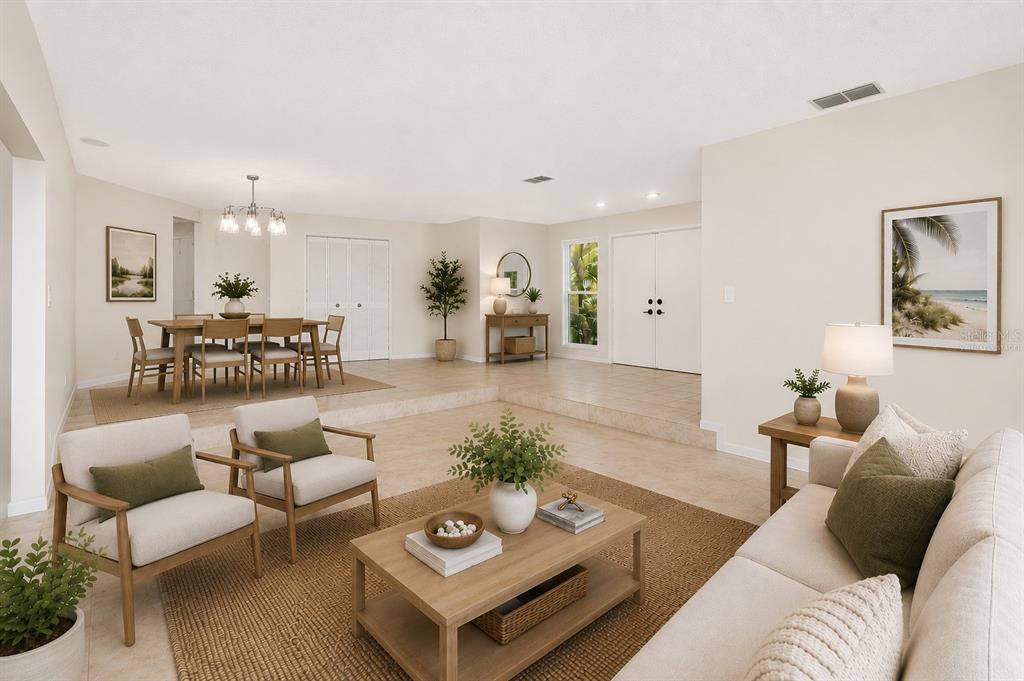 A sunken living room with light tile floors leads to a raised dining area — 2721 NORTHRIDGE DRIVE E, CLEARWATER, FL