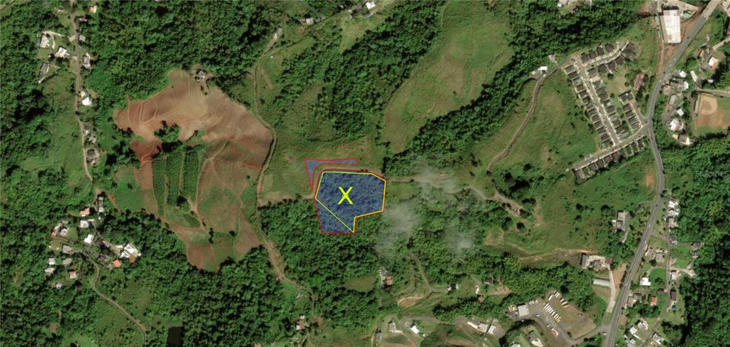 This aerial map shows a highlighted plot of land marked with an X — KM 0.2 INT Bo. Helechal PR 152, BARRANQUITAS, PR