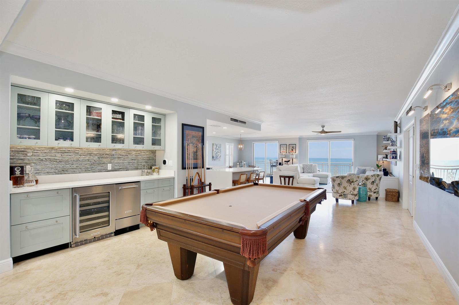 A room with a pool table, a wet bar, and a view of the ocean — 2465 S Atlantic Avenue # 401, Cocoa Beach FL 32931, COCOA BEACH, FL