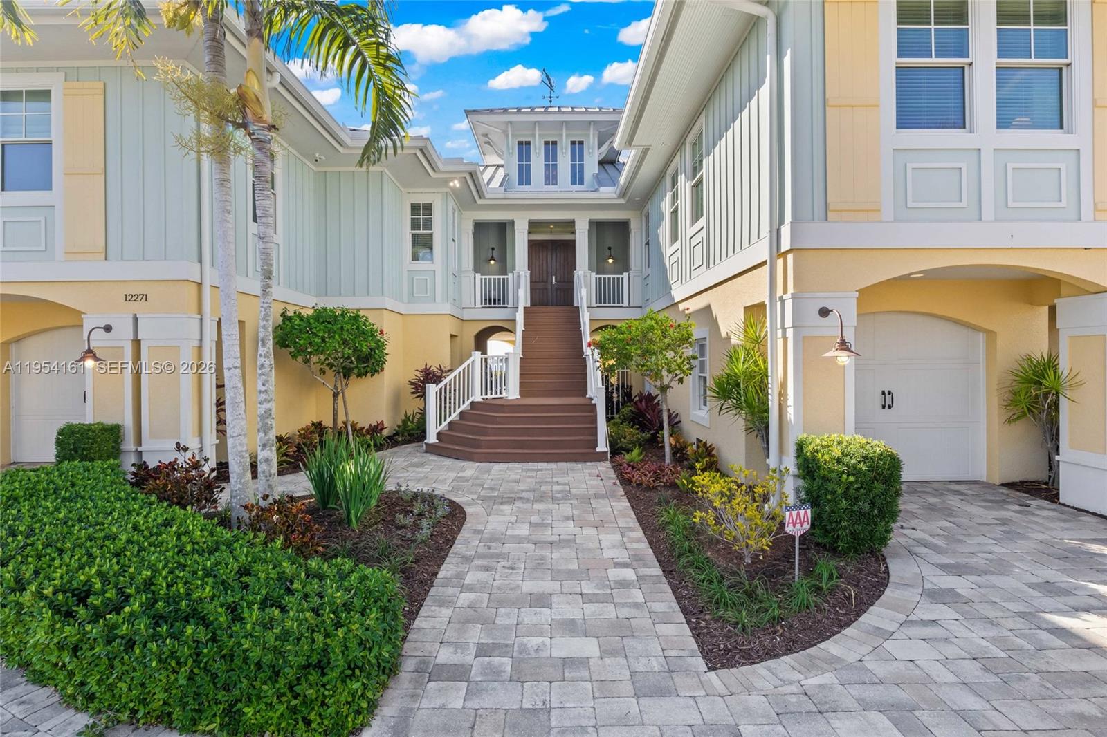 The entry to this home is so inviting and the details are everywhere - weather vane on the rooftop, metal roof, trex deck stairs, designer korbels - this has it all! — CAPE CORAL, FL