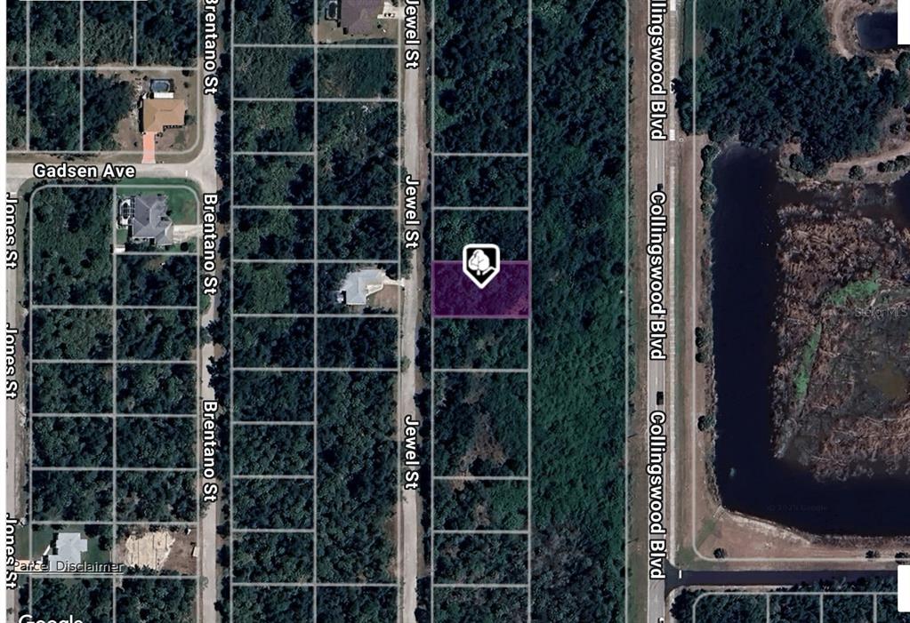 This is a satellite map view showing a vacant rectangular lot on Jewel Street — 3406 JEWEL STREET, PORT CHARLOTTE, FL