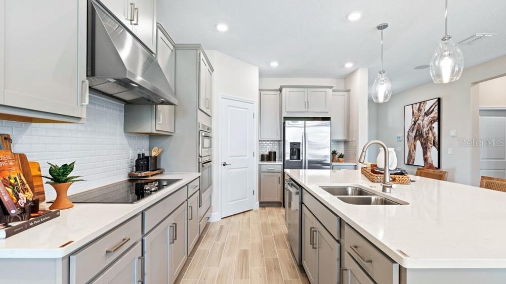 This is a floor plan of a home featuring a kitchen, great room, and garage — 12525 WHARF TERRACE, PALMETTO, FL