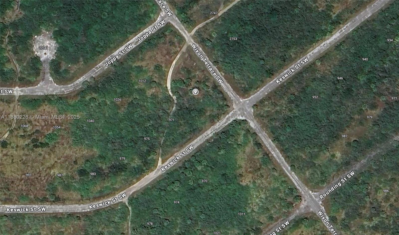 This is a satellite map view showing undeveloped land with intersecting streets — 967 SW Keswick St, Malabar FL 32908, MALABAR, FL