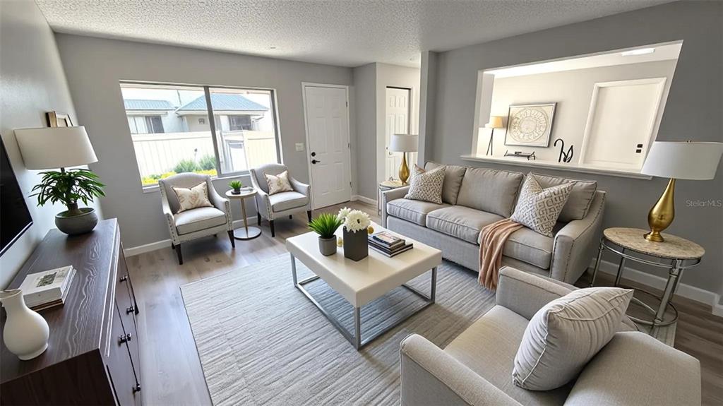 A living room features gray walls, light wood floors, a sofa, armchairs, and a coffee table — 4578 PHEASANT RUN DRIVE UNIT 7B, ORLANDO, FL