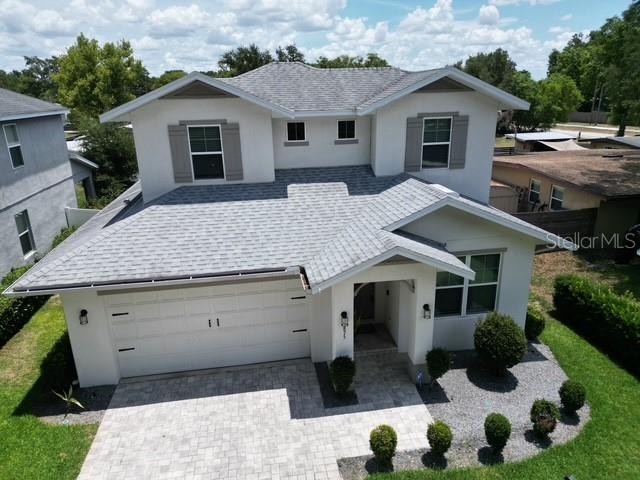 A two-story house with a gray shingled roof and a white exterior — 3875 S FERN CREEK AVENUE, ORLANDO, FL