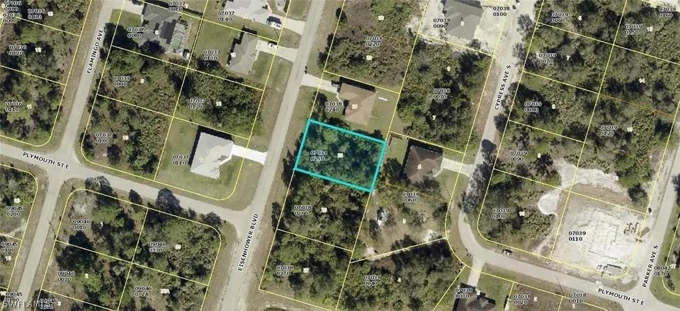 This is an aerial map showing a highlighted vacant lot in a residential neighborhood — 553 Eisenhower Boulevard, Lehigh Acres FL 33974, LEHIGH ACRES, FL