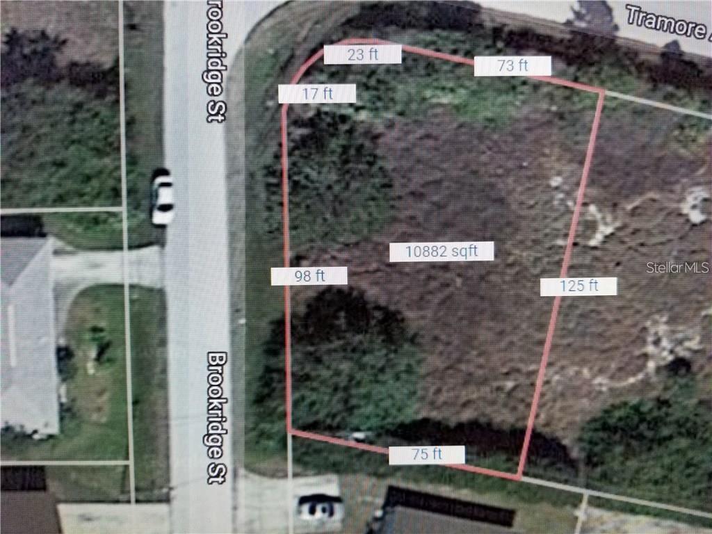 An aerial map shows the dimensions and square footage of a vacant residential lot — 10043-10075 TRAMORE AVENUE, ENGLEWOOD, FL