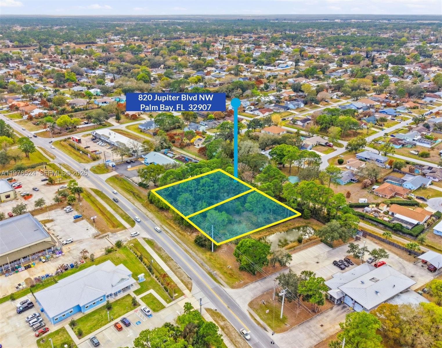 An aerial view shows two adjacent vacant lots highlighted in yellow along a paved road — 820 Jupiter Blvd NW, Palm Bay FL 32907, PALM BAY, FL