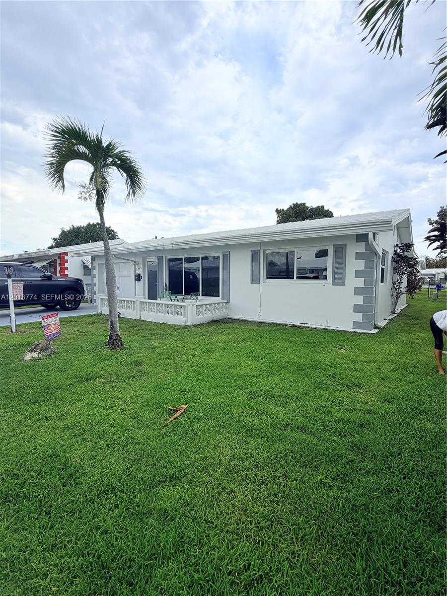 A white, single-story house with a palm tree in the front yard — 2960 NW 1st Dr, Pompano Beach FL 33064, POMPANO BEACH, FL