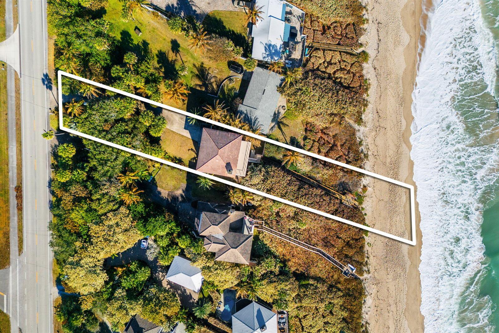 An aerial view shows a beachfront property outlined in white, featuring a house and boardwalk — 9085 S Highway A1a, Melbourne Beach FL 32951, MELBOURNE BEACH, FL