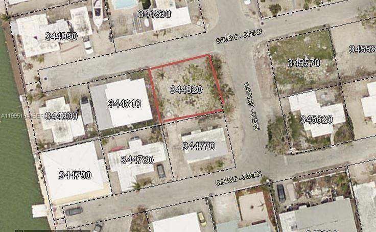 This is an aerial map showing a vacant lot outlined in red among residential properties — Lot 70 5th Ave Ocean, Marathon FL 33050, MARATHON, FL