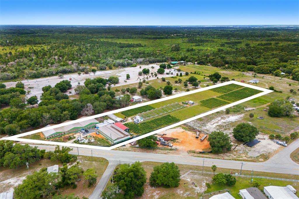 An aerial view shows a rectangular property with greenhouses, agricultural rows, and outbuildings — 3510 WALK IN WATER ROAD, LAKE WALES, FL
