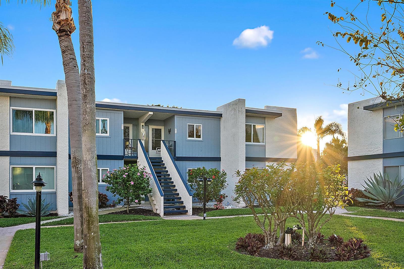 A kitchen with white cabinets, stainless steel appliances, a ceiling fan, and tile flooring — 1561 NE 12th Terrace # 14, Jensen Beach FL 34957, JENSEN BEACH, FL