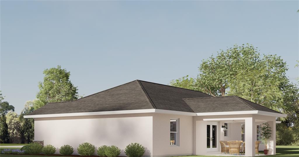A digital rendering of the rear exterior of a single-story house with a covered patio — TBD BAY COURT, OCKLAWAHA, FL