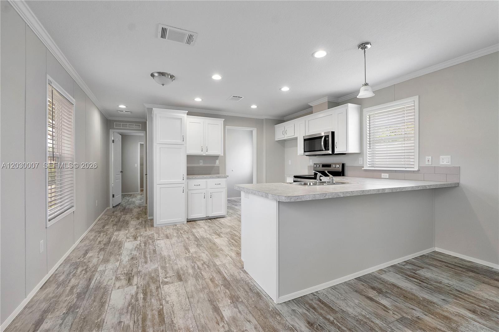This is a rendering of an open-concept living room and kitchen with light wood flooring — 5530 SW 32nd Ter, Dania Beach FL 33312, DANIA BEACH, FL