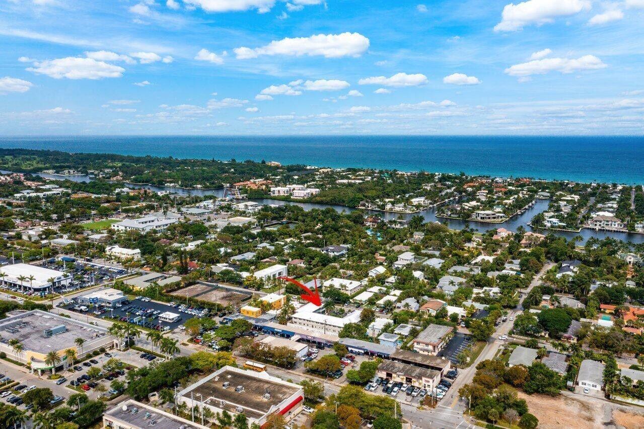 An aerial view of a coastal neighborhood with a red arrow pointing to a building — 426 NE 7th Avenue # 2b, Delray Beach FL 33483, DELRAY BEACH, FL