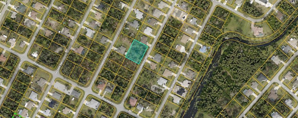 This is an aerial map showing a vacant residential lot highlighted in a suburban neighborhood — LOTS 19 & 20 SABRINA TERRACE, NORTH PORT, FL