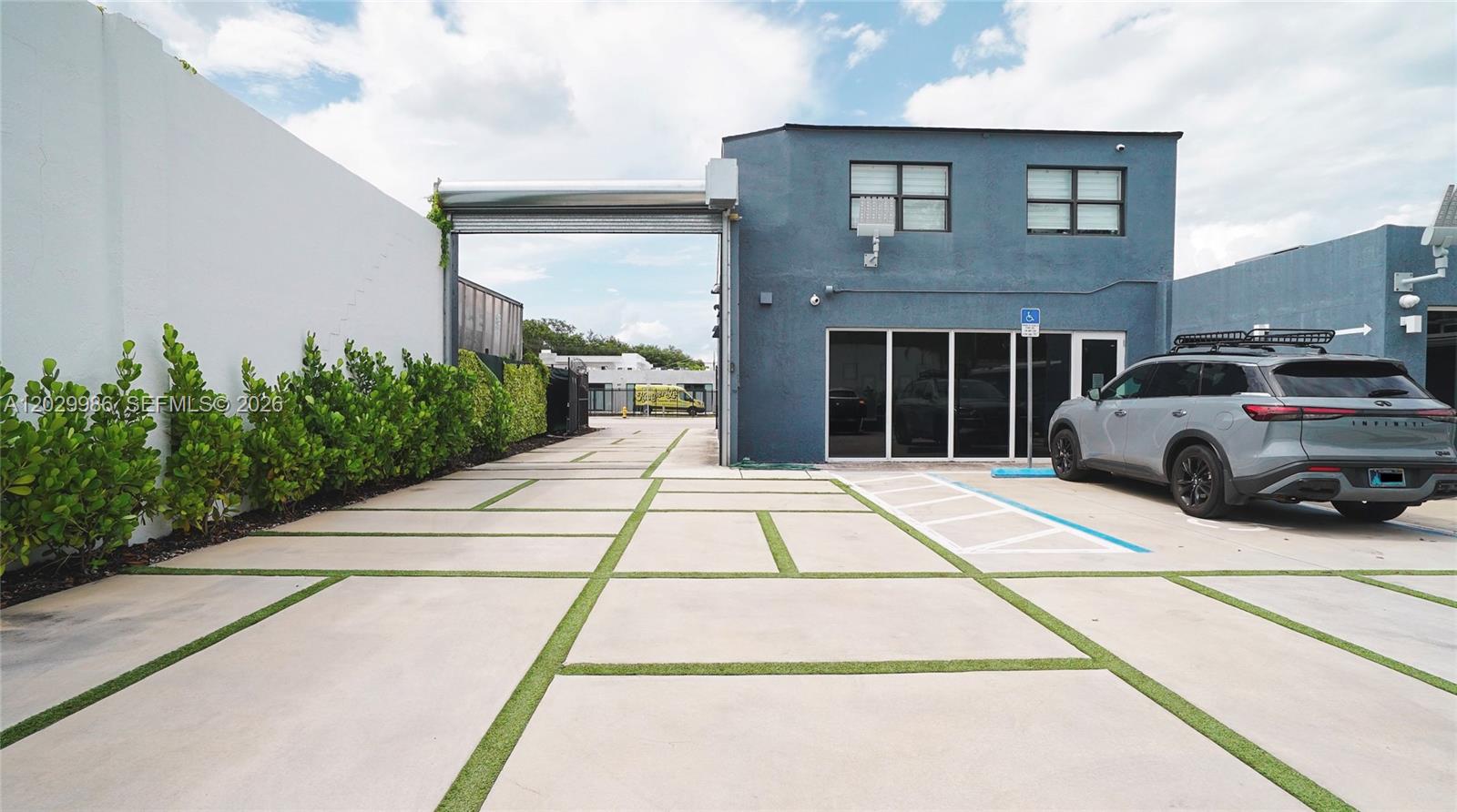 A blue two-story building with a paved driveway and a parked SUV — 530 NW 54th St, Miami FL 33127, MIAMI, FL