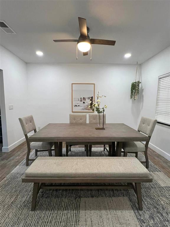 A dining room features a wooden table, four upholstered chairs, a bench, and a ceiling fan — 4455 NW 80TH TERRACE, OCALA, FL
