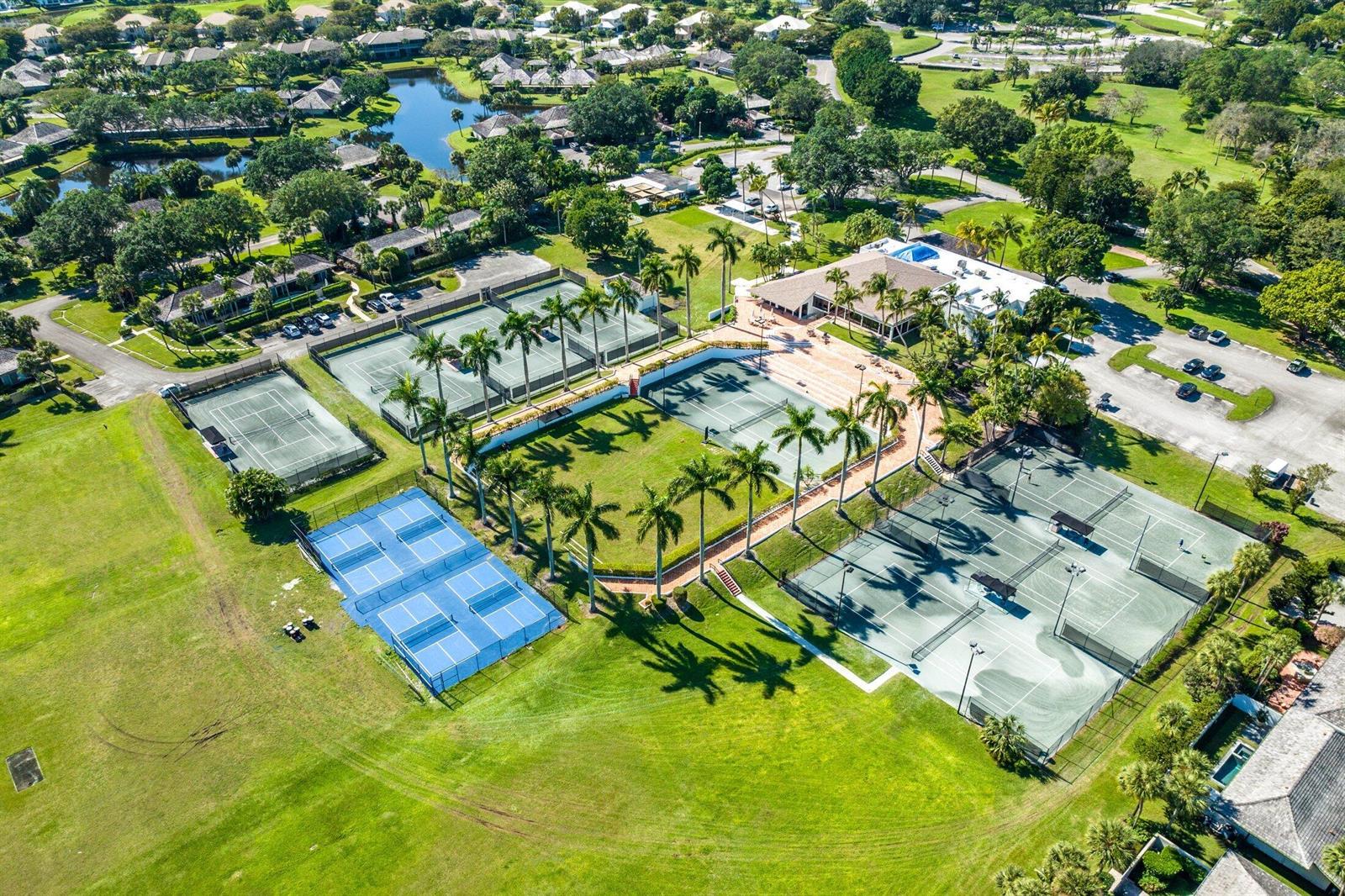 An aerial view shows a tennis facility with multiple courts, palm trees, and surrounding landscaping — 11863 Wimbledon Circle # 416, Wellington FL 33414, WELLINGTON, FL