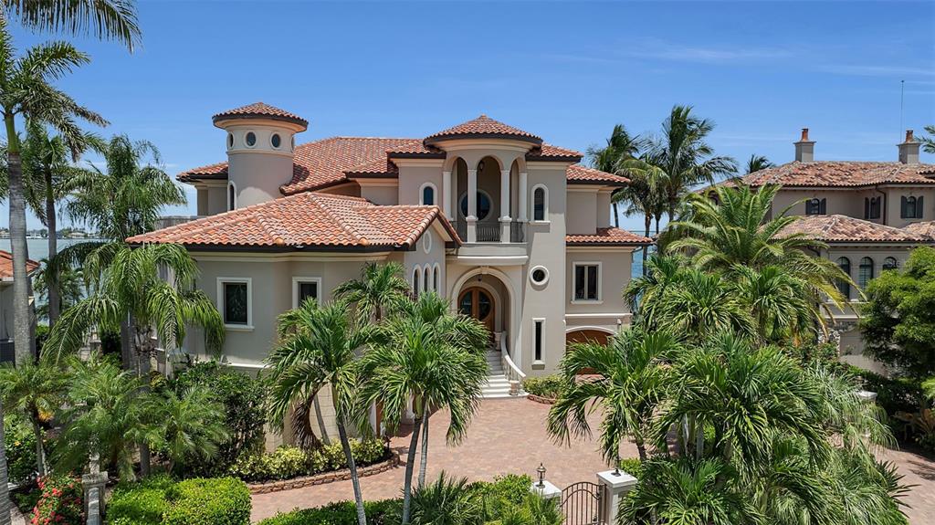 A waterfront infinity pool and hot tub overlook a bay with a bridge and skyline — 1372 HARBOR DRIVE, SARASOTA, FL
