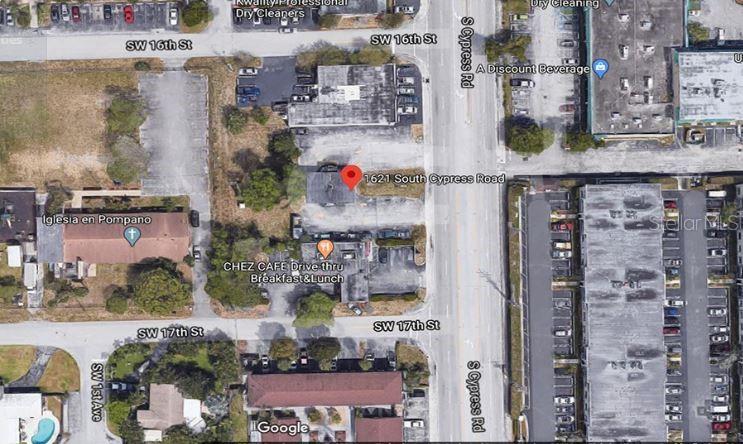 This is an aerial map view of a commercial property located at a street intersection — 1621 N CYPRESS ROAD, POMPANO BEACH, FL