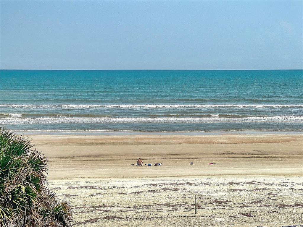A view of a sandy beach and the ocean from an elevated vantage point — 1913 HILL STREET UNIT 2, NEW SMYRNA BEACH, FL