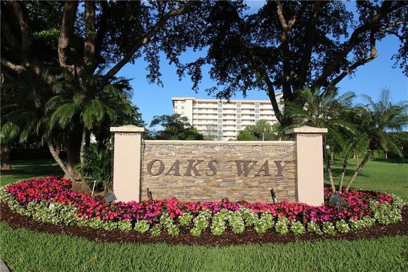 A stone monument sign reading Oaks Way sits in front of a large apartment building — 3507 Oaks Way # 307, Pompano Beach FL 33069, POMPANO BEACH, FL