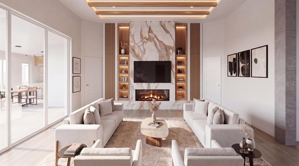 A modern open-concept living room and kitchen feature a large island and sliding glass doors — 3654 HIDDEN RIVER LANE, TAVARES, FL