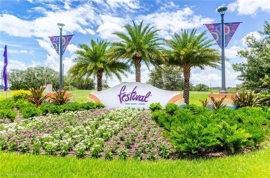 A sign for Festival Minto Resorts stands in a landscaped garden with palm trees — 840 BENOI DR DRIVE, DAVENPORT, FL