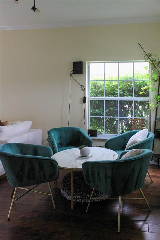 A dining area features four teal velvet chairs around a round marble-topped table — 12927 BOGGY POINTE DRIVE, ORLANDO, FL