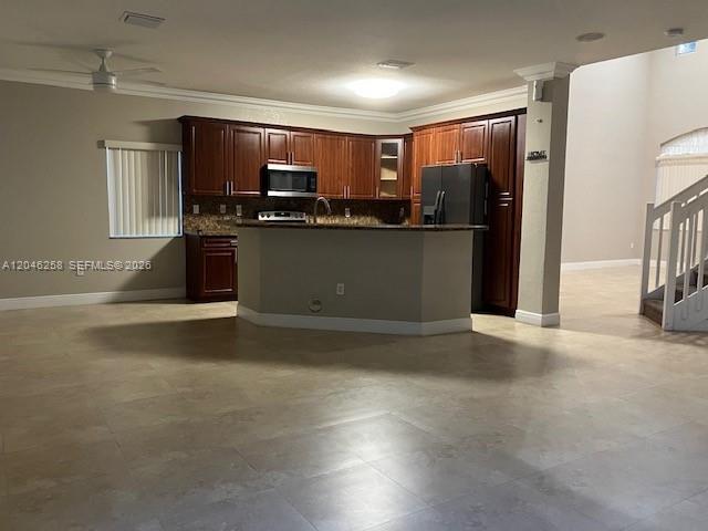 A kitchen with dark wood cabinets, a central island, and tile flooring — 10240 SW 227th Ln, Cutler Bay FL 33190, CUTLER BAY, FL
