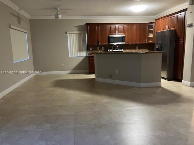 A kitchen with dark wood cabinets, stainless steel appliances, and tile flooring — 10240 SW 227th Ln, Cutler Bay FL 33190, CUTLER BAY, FL