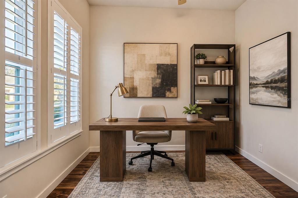 A home office features a wooden desk, an upholstered chair, a bookshelf, and plantation shutters — 6463 SW 77TH DRIVE, GAINESVILLE, FL