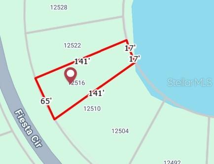 This is a map showing the property boundaries and dimensions of a residential lot — 12516 FIESTA CIRCLE, PUNTA GORDA, FL